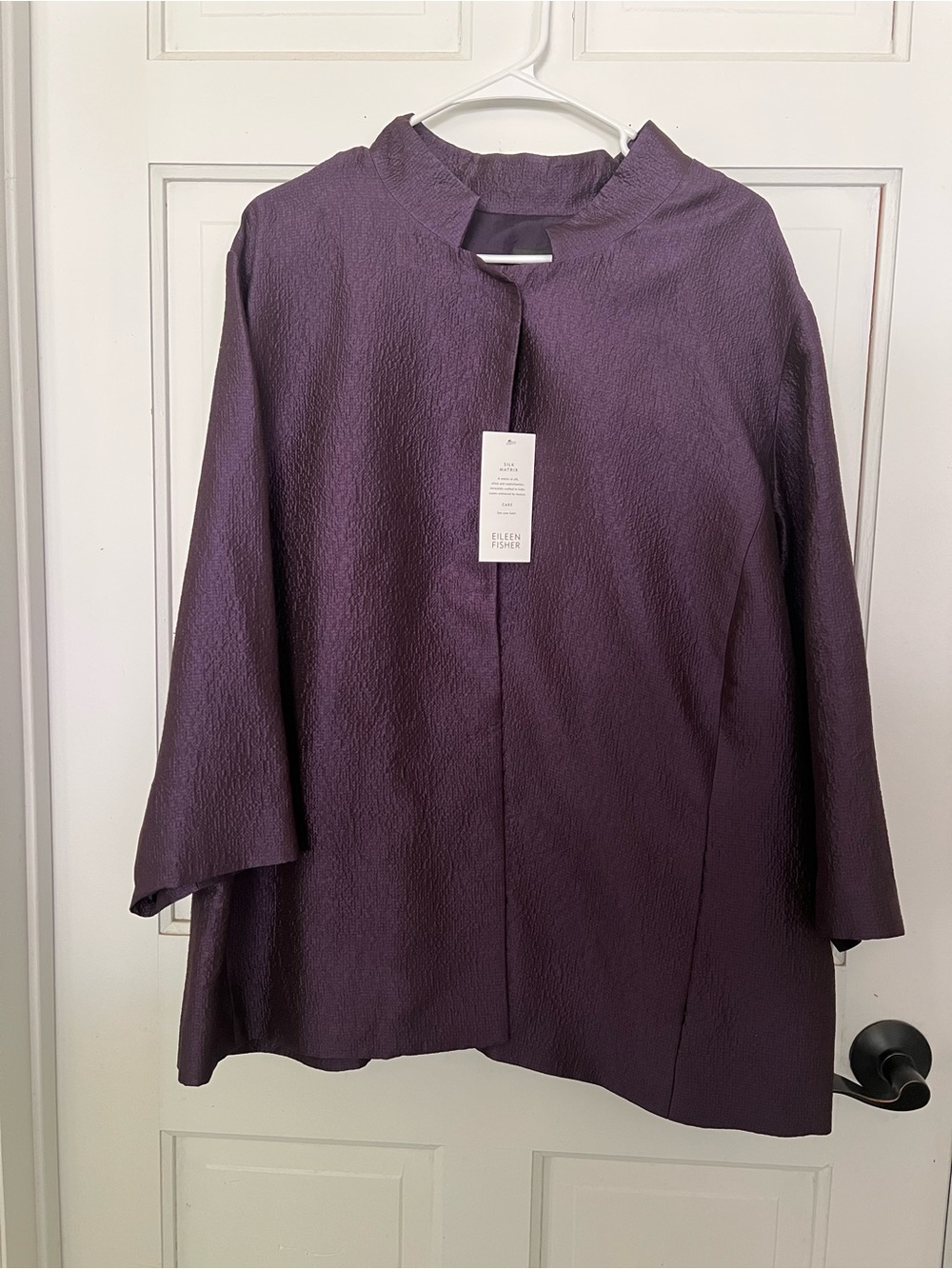 Eileen Fisher purple crinkle silk jacket with a stand collar and snap closure